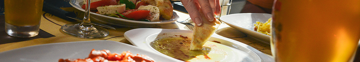 Eating Food Stand Greek at Tony Dragon's Grille restaurant in New York, NY.